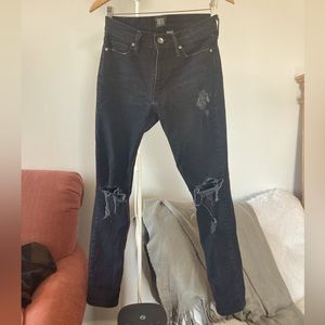 BDG Dark wash thick distressed denim jeans.